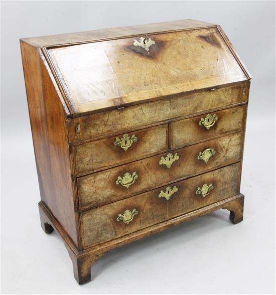 A George I feather banded walnut bureau, W.3ft 1in. D.1ft 8in. H.3ft 3in.